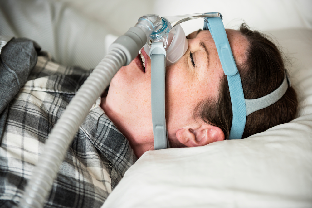 A Woman Sleeping With Anti Snoring Chin Strap 2022 12 16 01 19 10 Utc